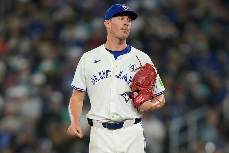 Jun 2, 2024; Toronto, Ontario, CAN; Toronto Blue Jays pitcher Chris Bassitt (40) reacts after hitting Pittsburgh Pirates right fielder Connor Joe with a pitch during the first inning at Rogers Centre. Mandatory Credit: John E. Sokolowski-USA TODAY Sports