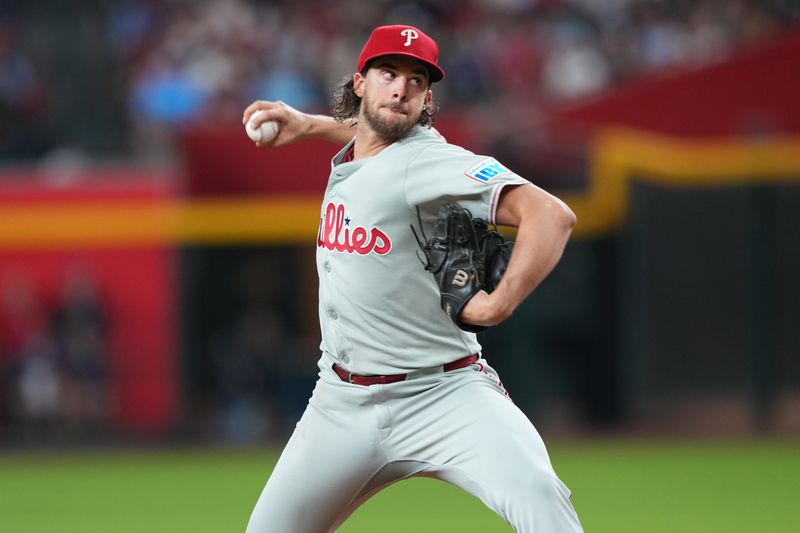 Sep 20, 2025; Phoenix, Arizona, USA; Philadelphia Phillies pitcher Aaron Nola (27) pitches against the Arizona Diamondbacks during the third inning at Chase Field. Mandatory Credit: Joe Camporeale-Imagn Images