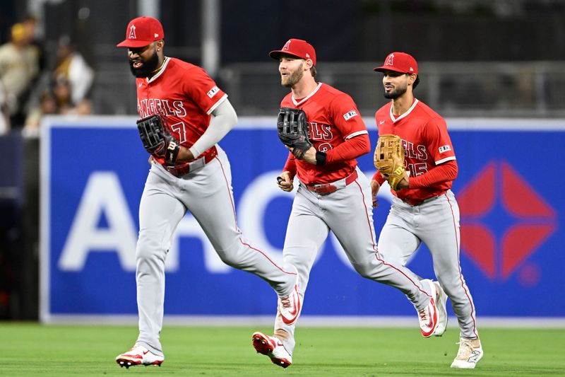 May 12, 2025; San Diego, California, USA; Los Angeles Angels outfielder Jo Adell (7), Taylor Ward (3) and Matthew Lugo (15) leave the field after the Angels beat the San Diego Padres 9-5 at Petco Park. Mandatory Credit: Denis Poroy-Imagn Images