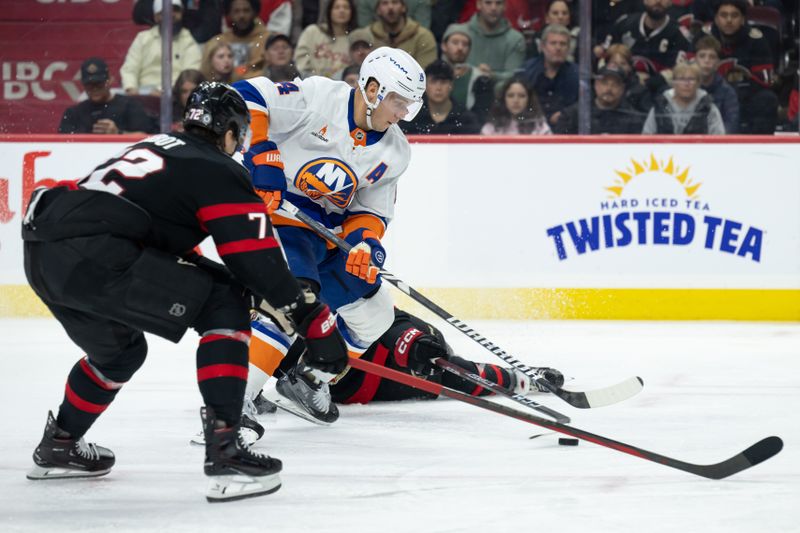 Nov 7, 2024; Ottawa, Ontario, CAN; New York Islanders center Bo Horvat (14) moves the puck past  Ottawa Senators defenseman Thomas Chabot (72) in the second period at the Canadian Tire Centre. Mandatory Credit: Marc DesRosiers-Imagn Images