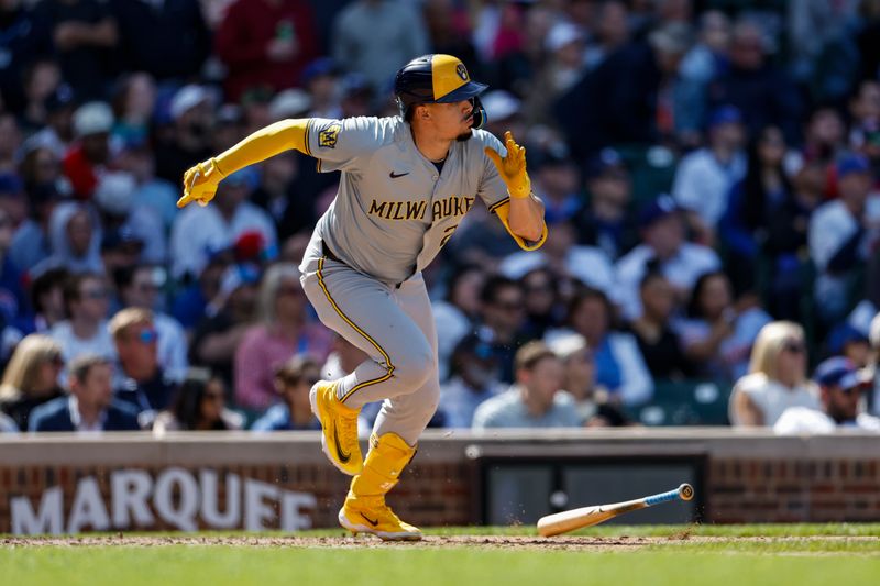 May 3, 2024; Chicago, Illinois, USA; Milwaukee Brewers shortstop Willy Adames (27) hits an RBI-single against the Chicago Cubs during the eight inning at Wrigley Field. Mandatory Credit: Kamil Krzaczynski-USA TODAY Sports