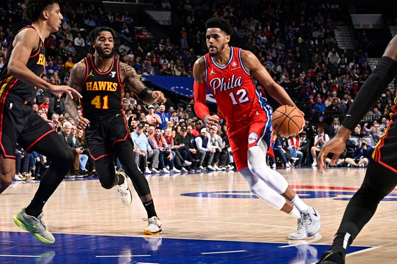 PHILADELPHIA, PA - FEBRUARY 9: Tobias Harris #12 of the Philadelphia 76ers drives to the basket during the game against the Atlanta Hawks on February 9, 2024 at the Wells Fargo Center in Philadelphia, Pennsylvania NOTE TO USER: User expressly acknowledges and agrees that, by downloading and/or using this Photograph, user is consenting to the terms and conditions of the Getty Images License Agreement. Mandatory Copyright Notice: Copyright 2024 NBAE (Photo by David Dow/NBAE via Getty Images)