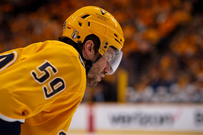 Apr 26, 2024; Nashville, Tennessee, USA; Nashville Predators defenseman Roman Josi (59) awaits the face-off against the Vancouver Canucks during the first period in game three of the first round of the 2024 Stanley Cup Playoffs at Bridgestone Arena. Mandatory Credit: Steve Roberts-USA TODAY Sports