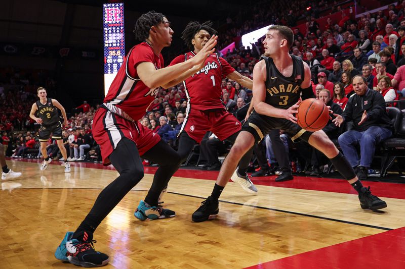 Jan 28, 2024; Piscataway, New Jersey, USA; Purdue Boilermakers guard Braden Smith (3) looks to pass asRutgers Scarlet Knights guard Jamichael Davis (1) and guard Derek Simpson (0) defend during the second half at Jersey Mike's Arena. Mandatory Credit: Vincent Carchietta-USA TODAY Sports