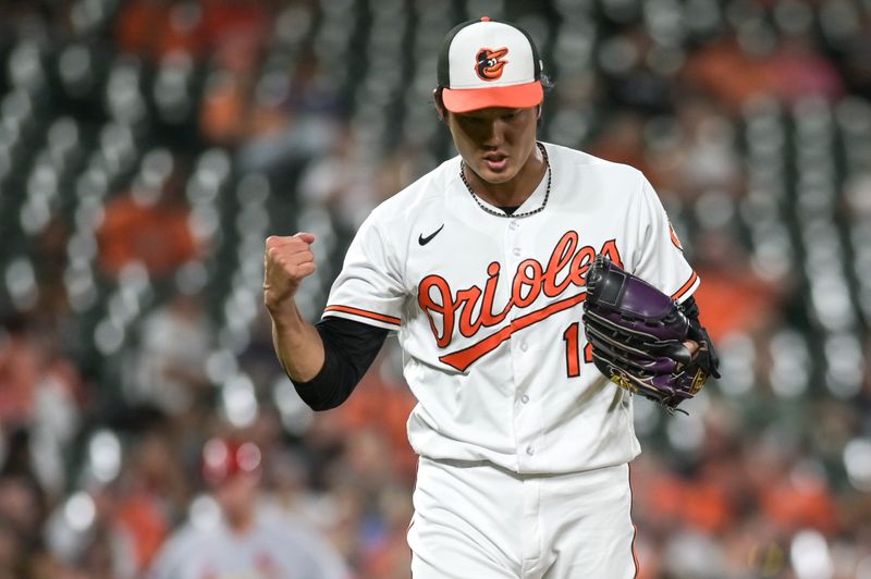 Sep 13, 2023; Baltimore, Maryland, USA;  Baltimore Orioles relief pitcher Shintaro Fujinami (14) exacts after the pitching the ninth inning against the St. Louis Cardinals at Oriole Park at Camden Yards. Mandatory Credit: Tommy Gilligan-USA TODAY Sports