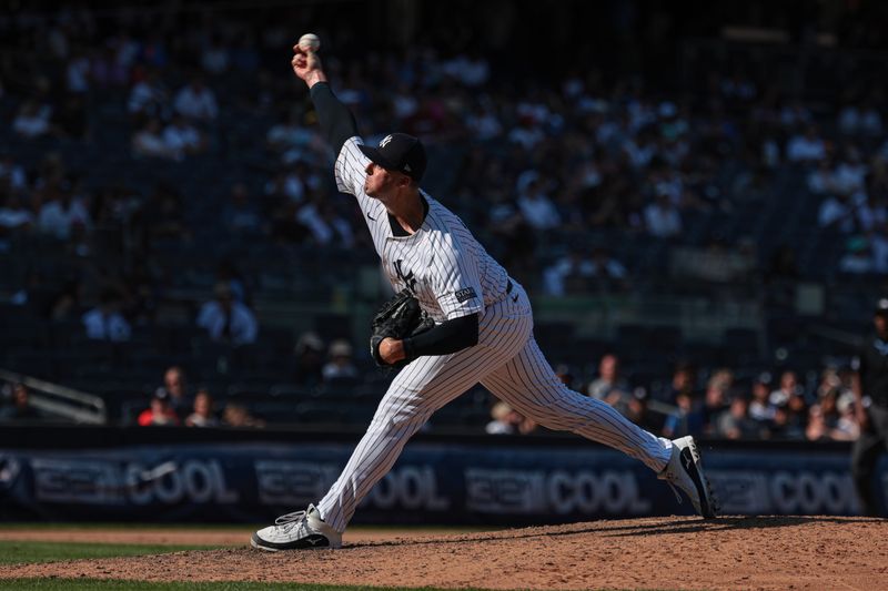 Aug 11, 2024; Bronx, New York, USA; New York Yankees relief pitcher Clay Holmes (35) delivers a pitch during the ninth inning against the Texas Rangers at Yankee Stadium. Mandatory Credit: Vincent Carchietta-USA TODAY Sports