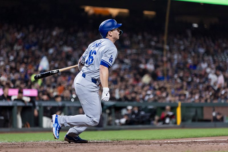 May 15, 2024; San Francisco, California, USA; Los Angeles Dodgers catcher Will Smith (16) hits a single against the San Francisco Giants during the eighth inning at Oracle Park. Mandatory Credit: John Hefti-USA TODAY Sports