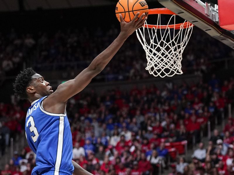 Jan 10, 2026; Salt Lake City, Utah, USA; BYU Cougars forward AJ Dybantsa (3) makes a driving layup during the first half against the Utah Utes at Jon M. Huntsman Center. Mandatory Credit: Aaron Baker-Imagn Images