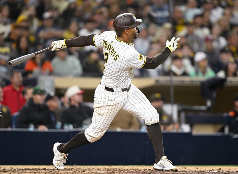 Apr 29, 2025; San Diego, California, USA; San Diego Padres shortstop Xander Bogaerts (2) hits a two-run home run during the seventh inning against the San Francisco Giants at Petco Park. Mandatory Credit: Denis Poroy-Imagn Images