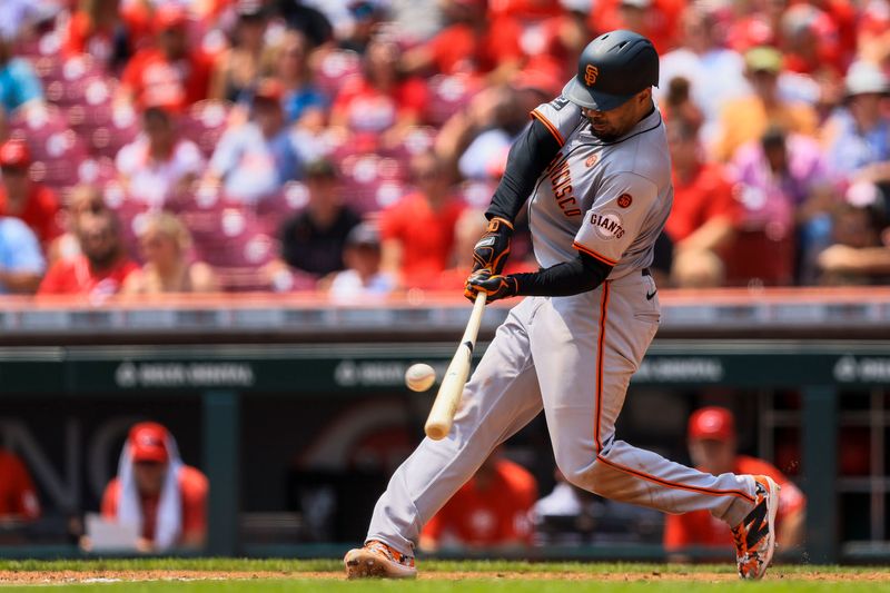 Aug 4, 2024; Cincinnati, Ohio, USA; San Francisco Giants first baseman LaMonte Wade Jr. (31) hits a solo home run in the sixth inning against the Cincinnati Reds at Great American Ball Park. Mandatory Credit: Katie Stratman-USA TODAY Sports