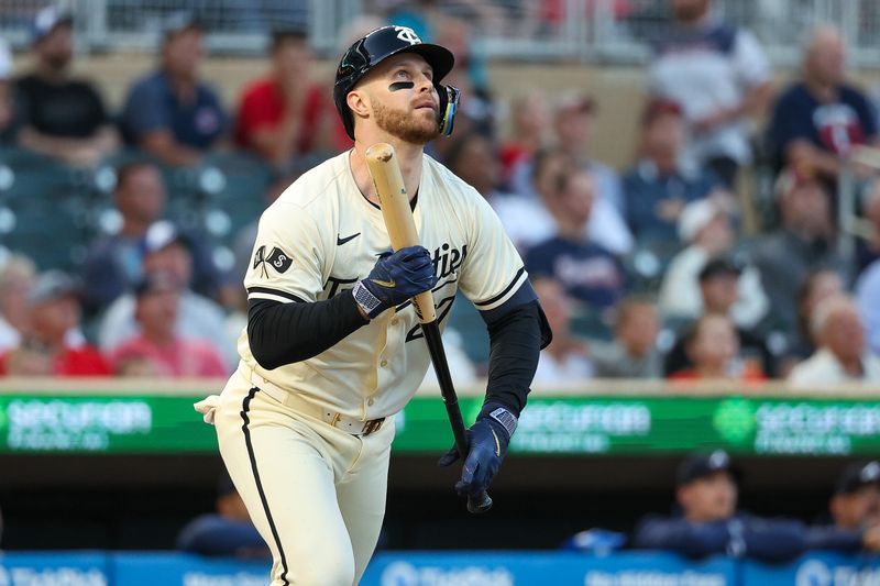 Aug 28, 2024; Minneapolis, Minnesota, USA; Minnesota Twins designated hitter Ryan Jeffers (27) hits a ground rule double against the Atlanta Braves during the fourth inning at Target Field. Mandatory Credit: Matt Krohn-USA TODAY Sports