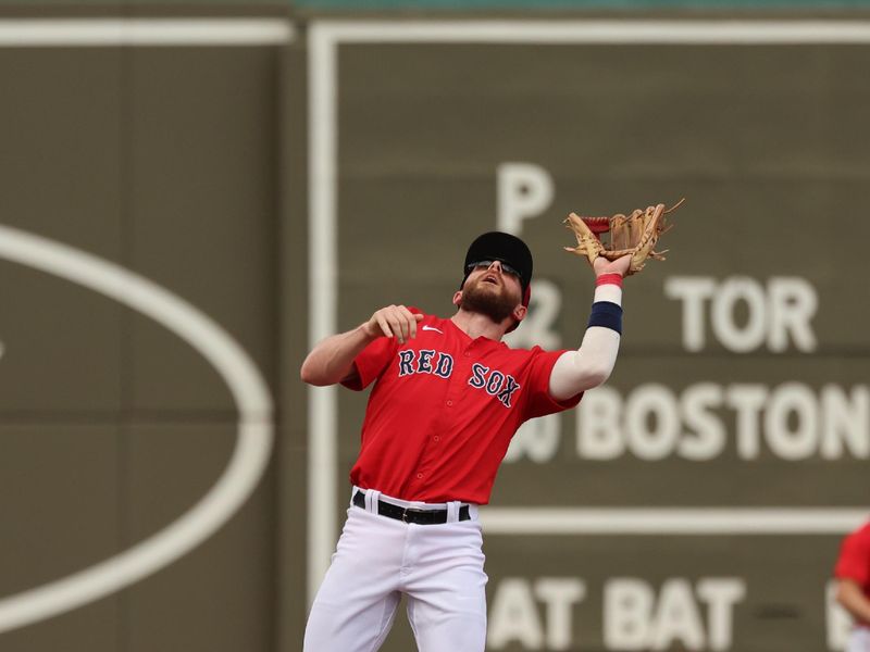 Mar 3, 2024; Fort Myers, Florida, USA; Boston Red Sox shortstop Trevor Story (10) catches a fly ball during the second inning against the Toronto Blue Jays at JetBlue Park at Fenway South. Mandatory Credit: Kim Klement Neitzel-USA TODAY Sports