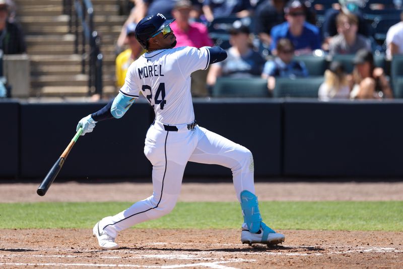 Apr 13, 2025; Tampa, Florida, USA; Tampa Bay Rays left fielder Christopher Morel (24) hit a rbi single against the Atlanta Braves in the fifth inning at George M. Steinbrenner Field. Mandatory Credit: Nathan Ray Seebeck-Imagn Images