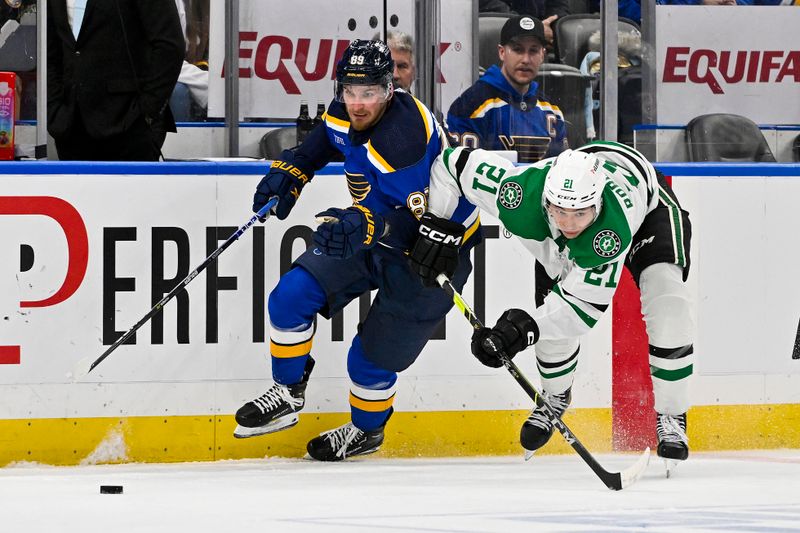 Dec 27, 2023; St. Louis, Missouri, USA;  St. Louis Blues left wing Pavel Buchnevich (89) and Dallas Stars left wing Jason Robertson (21)  battle for the puck during the second period at Enterprise Center. Mandatory Credit: Jeff Curry-USA TODAY Sports