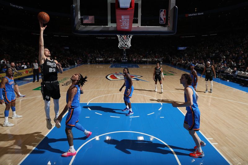 OKLAHOMA CITY, OK - APRIL 10:  Zach Collins #23 of the San Antonio Spurs shoots the ball during the game against the Oklahoma City Thunder on April 10, 2024 at Paycom Arena in Oklahoma City, Oklahoma. NOTE TO USER: User expressly acknowledges and agrees that, by downloading and or using this photograph, User is consenting to the terms and conditions of the Getty Images License Agreement. Mandatory Copyright Notice: Copyright 2024 NBAE (Photo by Zach Beeker/NBAE via Getty Images)