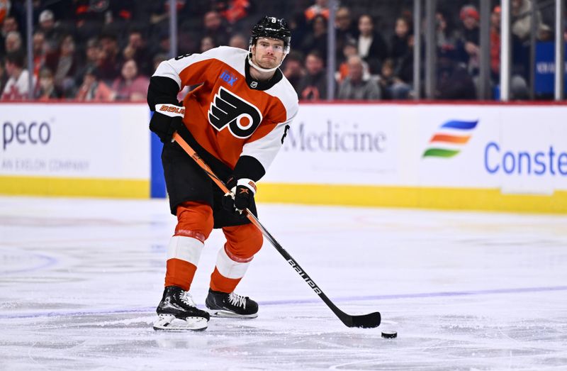 Dec 14, 2023; Philadelphia, Pennsylvania, USA; Philadelphia Flyers defenseman Cam York (8) controls the puck against the Washington Capitals in the first period at Wells Fargo Center. Mandatory Credit: Kyle Ross-USA TODAY Sports