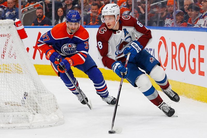 Mar 16, 2024; Edmonton, Alberta, CAN; Colorado Avalanche defensemen Cale Makar (8) moves the puck in front of Edmonton Oilers forward Warren Foegele (37) during the first period at Rogers Place. Mandatory Credit: Perry Nelson-USA TODAY Sports