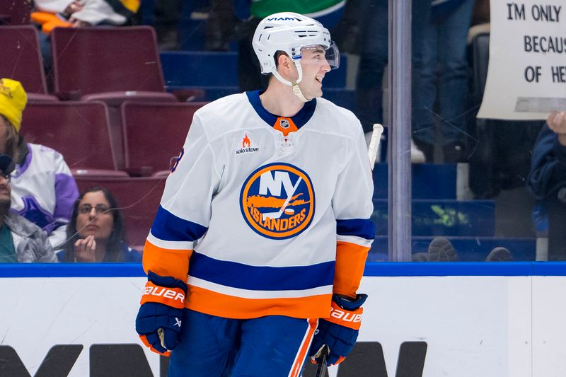 Nov 14, 2024; Vancouver, British Columbia, CAN; New York Islanders defenseman Noah Dobson (8) celebrates his goal against the Vancouver Canucks during the third period at Rogers Arena. Mandatory Credit: Bob Frid-Imagn Images