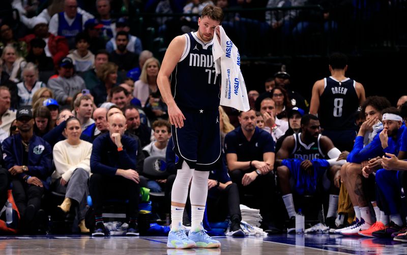 DALLAS, TX - JANUARY 27: Luka Doncic #77 of the Dallas Mavericks towels off during a break in the action against the Sacramento Kings in the second half at American Airlines Center on January 27, 2024 in Dallas, Texas. NOTE TO USER: User expressly acknowledges and agrees that, by downloading and or using this photograph, User is consenting to the terms and conditions of the Getty Images License Agreement. (Photo by Ron Jenkins/Getty Images)