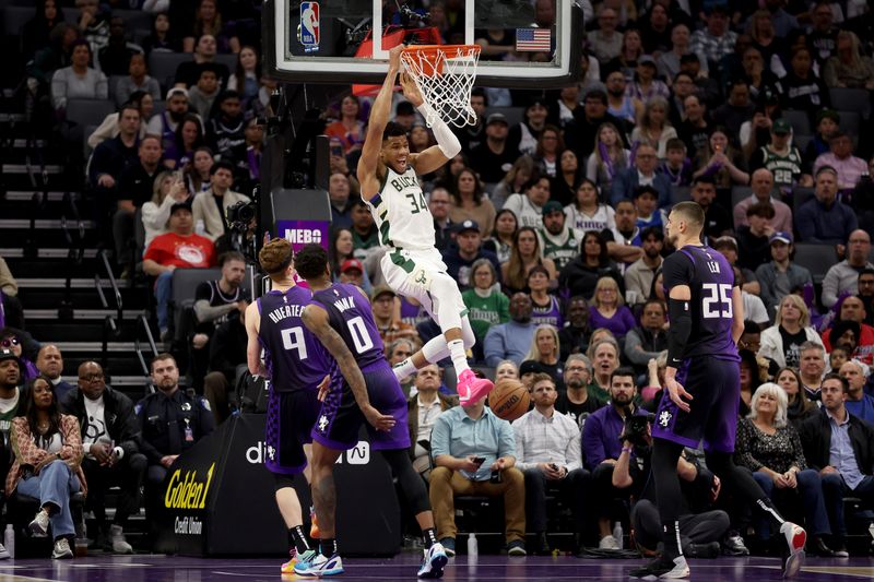 SACRAMENTO, CALIFORNIA - MARCH 12: Giannis Antetokounmpo #34 of the Milwaukee Bucks dunks the ball on the Sacramento Kings in the first half at Golden 1 Center on March 12, 2024 in Sacramento, California. NOTE TO USER: User expressly acknowledges and agrees that, by downloading and or using this photograph, User is consenting to the terms and conditions of the Getty Images License Agreement.  (Photo by Ezra Shaw/Getty Images)