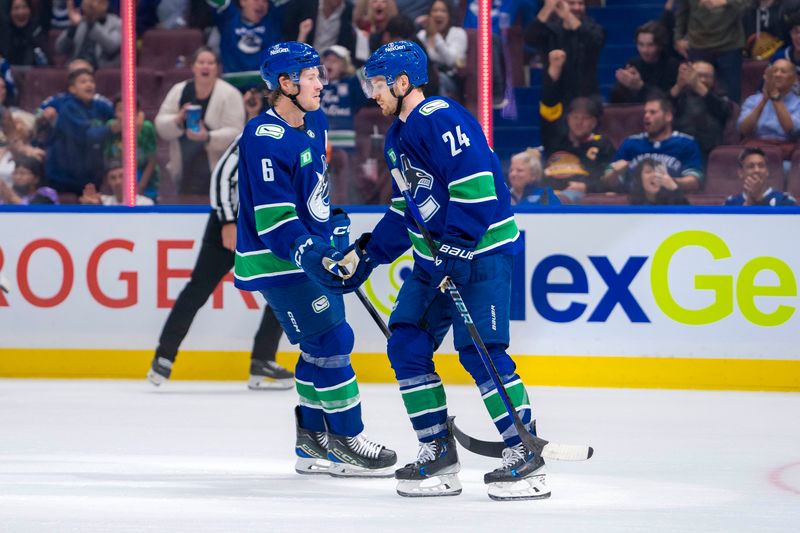 Sep 24, 2024; Vancouver, British Columbia, CAN; Vancouver Canucks forward Brock Boeser (6) and forward Pius Suter (24) celebrate Suter’s goal against the Seattle Kraken during the third period at Rogers Arena. Mandatory Credit: Bob Frid-Imagn Images