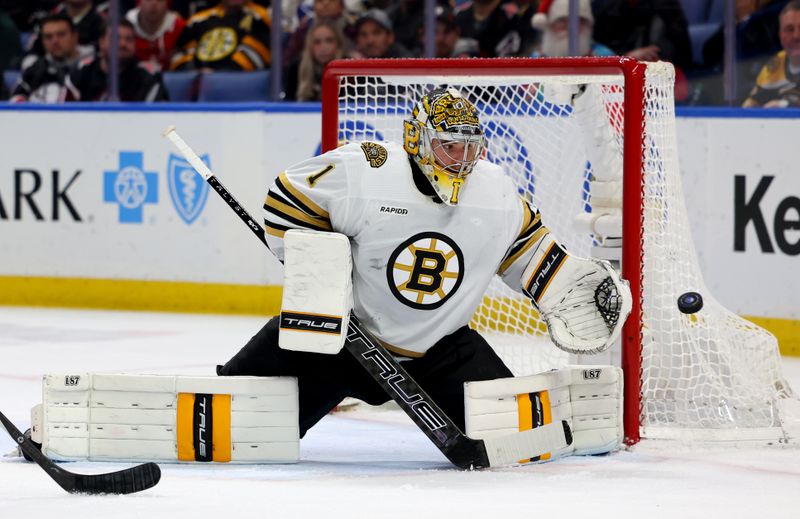 Dec 27, 2023; Buffalo, New York, USA;  Boston Bruins goaltender Jeremy Swayman (1) makes a save during the second period against the Buffalo Sabres at KeyBank Center. Mandatory Credit: Timothy T. Ludwig-USA TODAY Sports