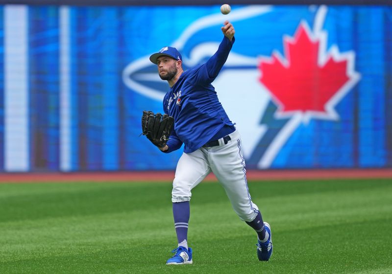 Sep 9, 2023; Toronto, Ontario, CAN; Toronto Blue Jays relief pitcher Tim Mayza (58) throws a ball during batting practice before a game against the Kansas City Royals at Rogers Centre. Mandatory Credit: Nick Turchiaro-USA TODAY Sports