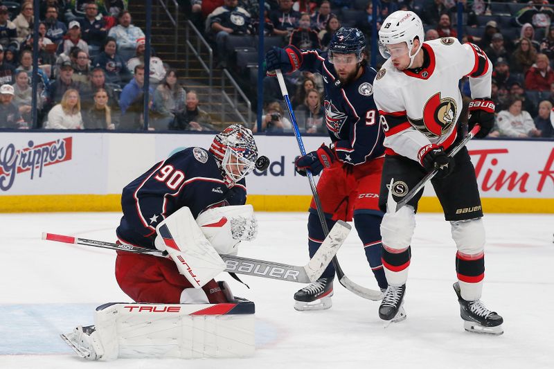 Dec 1, 2023; Columbus, Ohio, USA; Columbus Blue Jackets goalie Elvis Merzlikins (90) makes a save as Ottawa Senators right wing Drake Batherson (19) looks for a rebound during the third period at Nationwide Arena. Mandatory Credit: Russell LaBounty-USA TODAY Sports