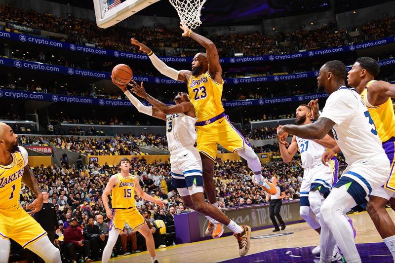 LOS ANGELES, CA - OCTOBER 22: LeBron James #23 of the Los Angeles Lakers blocks the basket during the game against the Minnesota Timberwolves on October 22, 2024 at Crypto.Com Arena in Los Angeles, California. NOTE TO USER: User expressly acknowledges and agrees that, by downloading and/or using this Photograph, user is consenting to the terms and conditions of the Getty Images License Agreement. Mandatory Copyright Notice: Copyright 2024 NBAE (Photo by Adam Pantozzi/NBAE via Getty Images)