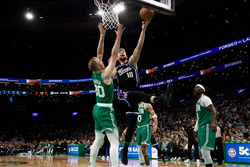 BOSTON, MA - APRIL 5: Domantas Sabonis #10 of the Sacramento Kings puts up a shot over Sam Hauser #30 of the Boston Celtics during the second half at TD Garden on April 5, 2024 in Boston, Massachusetts. NOTE TO USER: User expressly acknowledges and agrees that, by downloading and/or using this Photograph, user is consenting to the terms and conditions of the Getty Images License Agreement. (Photo By Winslow Townson/Getty Images)