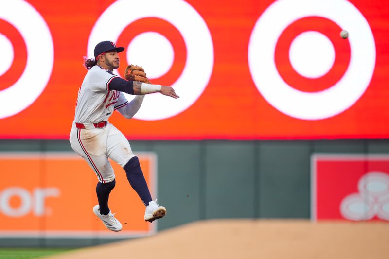 Aug 12, 2024; Minneapolis, Minnesota, USA; Minnesota Twins second base Austin Martin (82) throws to first base against the Kansas City Royals in the fifth inning at Target Field. Mandatory Credit: Brad Rempel-USA TODAY Sports