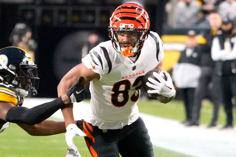 Cincinnati Bengals wide receiver Tyler Boyd (83) runs after a catch during the first half of an NFL football game against the Pittsburgh Steelers in Pittsburgh, Saturday, Dec. 23, 2023. (AP Photo/Gene J. Puskar)