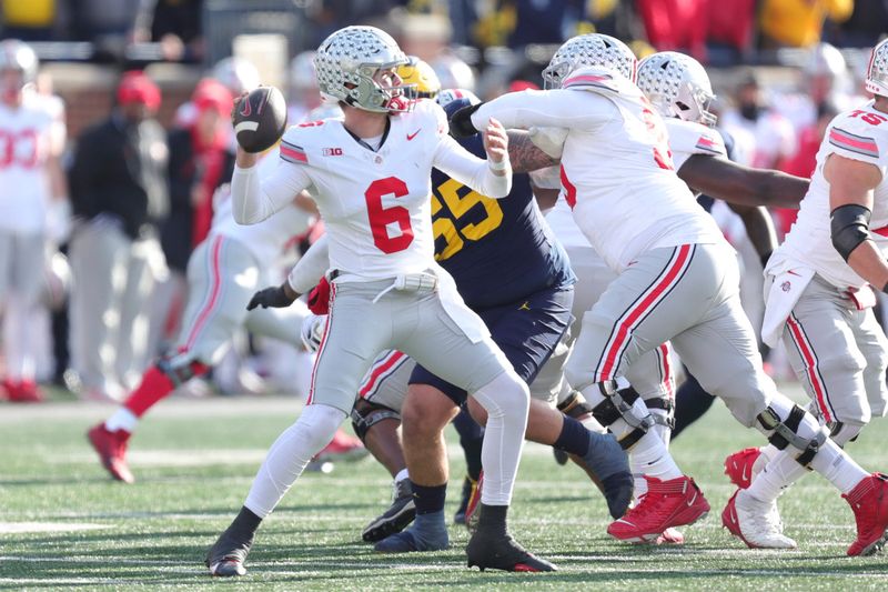 Nov 25, 2023; Ann Arbor, MI, USA;  Ohio State quarterback Kyle McCord makes a pass against Ohio State during the first half at Michigan Stadium in Ann Arbor on Saturday, Nov. 25, 2023. Mandatory Credit: Junfu Han-USA TODAY Sports