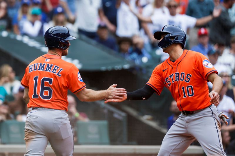 Jul 20, 2025; Seattle, Washington, USA; Houston Astros left fielder Cooper Hummel (16) and third baseman Shay Whitcomb (10) greet each other after scoring runs against the Seattle Mariners during the fifth inning at T-Mobile Park. Mandatory Credit: Joe Nicholson-Imagn Images