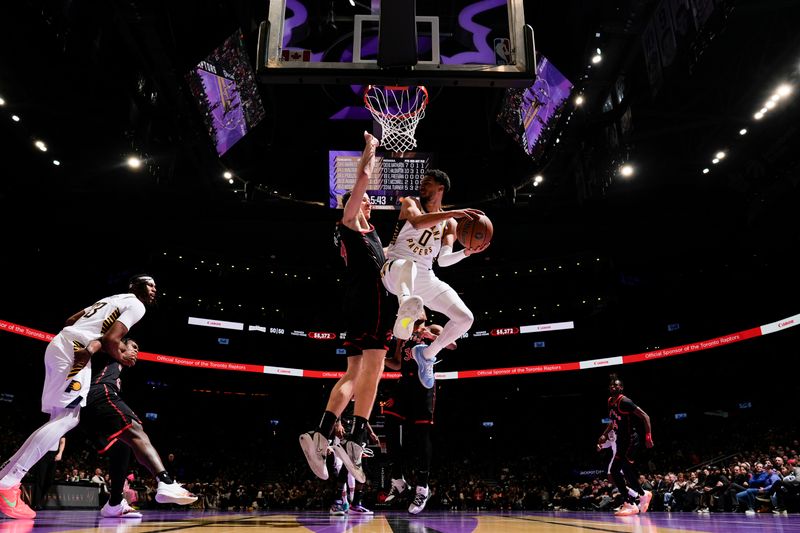 TORONTO, CANADA - DECEMBER 3: Tyrese Haliburton #0 of the Indiana Pacers handles the ball during the game against the Toronto Raptors during the Emirates NBA Cup game on December 3, 2024 at the Scotiabank Arena in Toronto, Ontario, Canada.  NOTE TO USER: User expressly acknowledges and agrees that, by downloading and or using this Photograph, user is consenting to the terms and conditions of the Getty Images License Agreement.  Mandatory Copyright Notice: Copyright 2024 NBAE (Photo by Mark Blinch/NBAE via Getty Images)