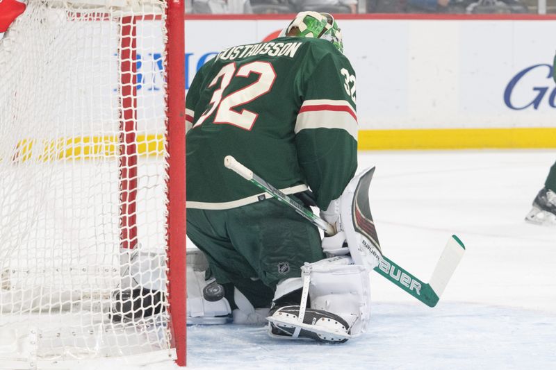 Apr 4, 2024; Saint Paul, Minnesota, USA; Minnesota Wild goaltender Filip Gustavsson (32) is beat by Colorado Avalanche left wing Artturi Lehkonen (62) in the first period at Xcel Energy Center. Mandatory Credit: Matt Blewett-USA TODAY Sports