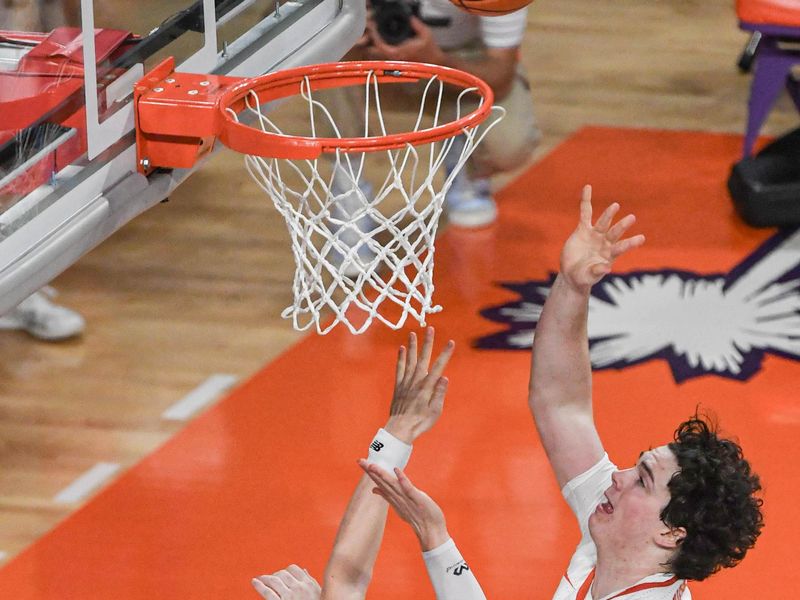 Jan 13, 2024; Clemson, South Carolina, USA; Clemson Tigers forward Ian Schieffelin (4) shoots the ball against Boston College Eagles guard Mason Madsen (45) during the first half at Littlejohn Coliseum. Mandatory Credit: Ken Ruinard-USA TODAY Sports