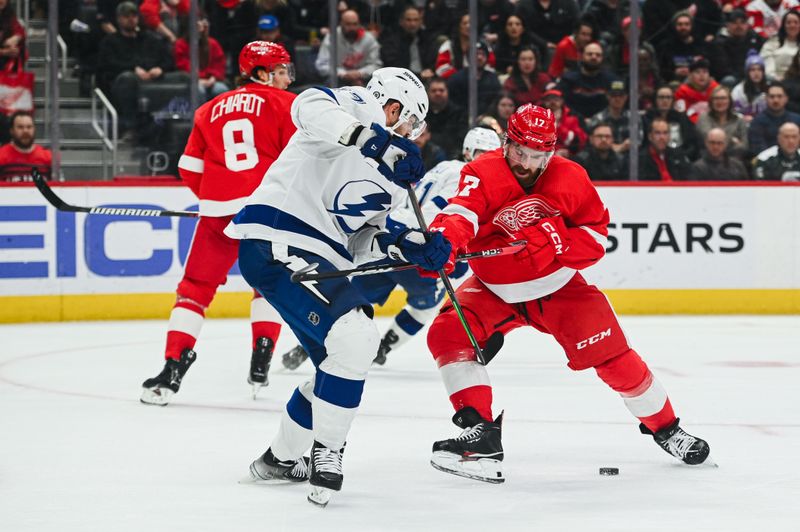 Feb 25, 2023; Detroit, Michigan, USA; Detroit Red Wings defenseman Filip Hronek (17) and Tampa Bay Lightning left wing Alex Killorn (17) battle for the puck during the third period at Little Caesars Arena. Mandatory Credit: Tim Fuller-USA TODAY Sports