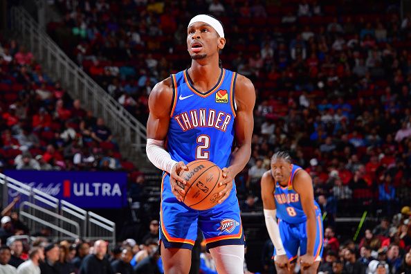 HOUSTON, TX - DECEMBER 6:   Shai Gilgeous-Alexander #2 of the Oklahoma City Thunder shoots a free throw during the game against the Houston Rockets on December 6, 2023 at the Toyota Center in Houston, Texas. NOTE TO USER: User expressly acknowledges and agrees that, by downloading and or using this photograph, User is consenting to the terms and conditions of the Getty Images License Agreement. Mandatory Copyright Notice: Copyright 2023 NBAE (Photo by Michael Gonzales/NBAE via Getty Images)