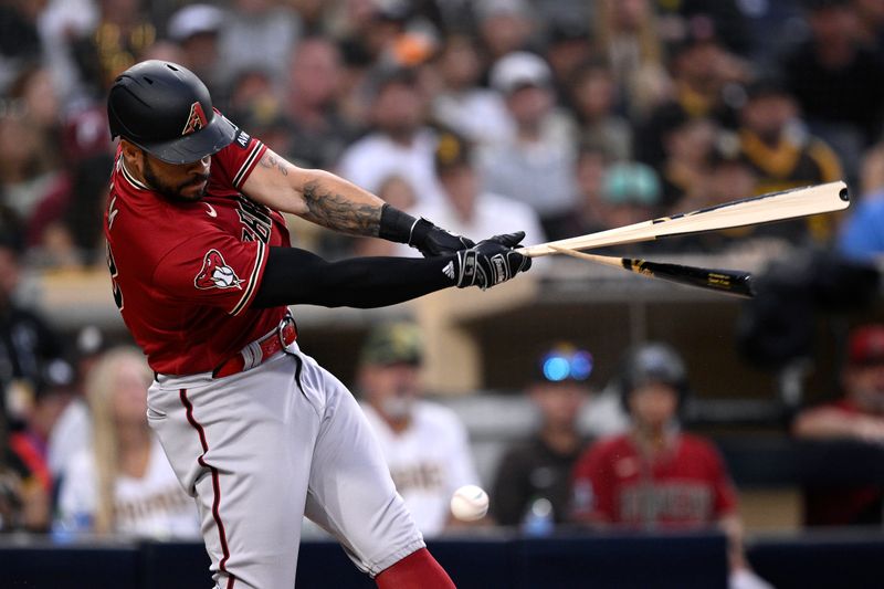 Aug 19, 2023; San Diego, California, USA; Arizona Diamondbacks left fielder Tommy Pham (28) breaks his bat during the fifth inning against the San Diego Padres at Petco Park. Mandatory Credit: Orlando Ramirez-USA TODAY Sports