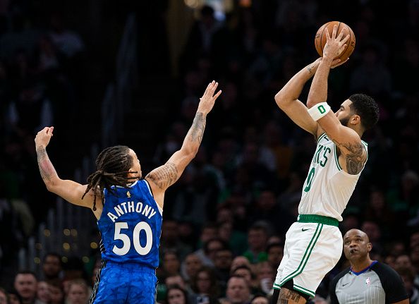 Boston, MA - December 17: Boston Celtics SF Jayson Tatum shoots a 3-pointer over Orlando Magic PG Cole Anthony in the third quarter. The Celtics beat the Magic, 114-97. (Photo by Tanner Pearson/The Boston Globe via Getty Images)