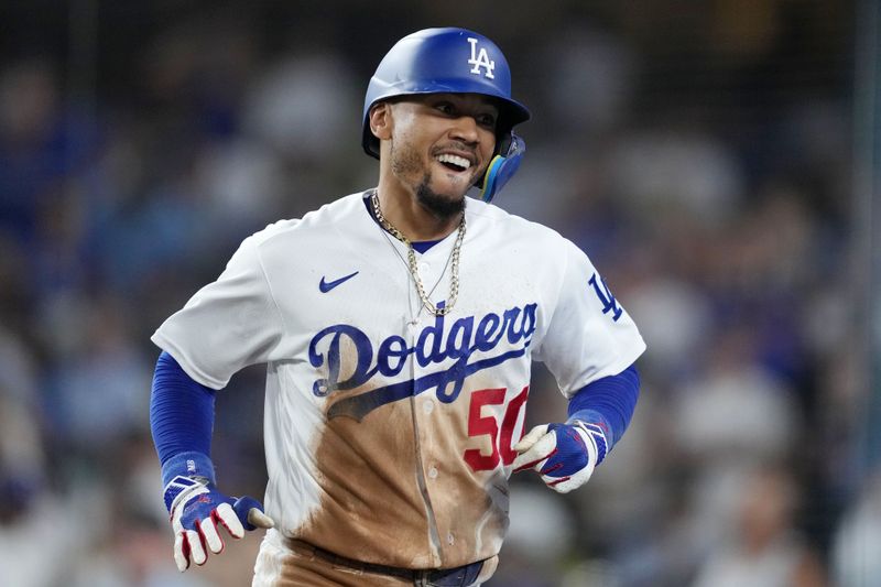 Aug 29, 2023; Los Angeles, California, USA; Los Angeles Dodgers second baseman Mookie Betts (50) celebrates after hitting a home run in the sixth inning Arizona Diamondbacksa at Dodger Stadium. Mandatory Credit: Kirby Lee-USA TODAY Sports