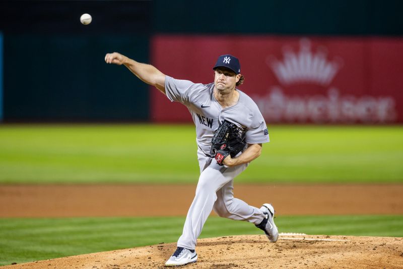 Sep 20, 2024; Oakland, California, USA; New York Yankees pitcher Gerrit Cole (45) throws a pitch third inning against the Oakland Athletics at Oakland-Alameda County Coliseum. Mandatory Credit: Bob Kupbens-Imagn Images