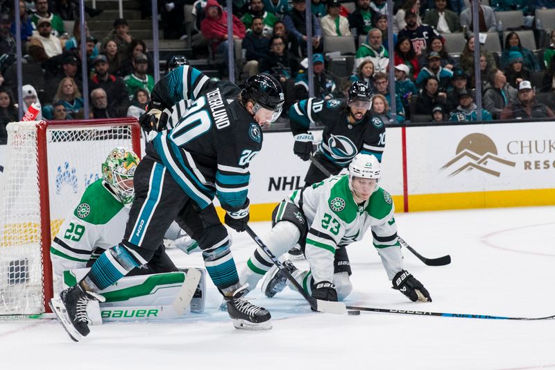 Mar 5, 2024; San Jose, California, USA; Dallas Stars defenseman Esa Lindell (23) defends goal against San Jose Sharks left wing Fabian Zetterlund (20) during the second period at SAP Center at San Jose. Mandatory Credit: John Hefti-USA TODAY Sports