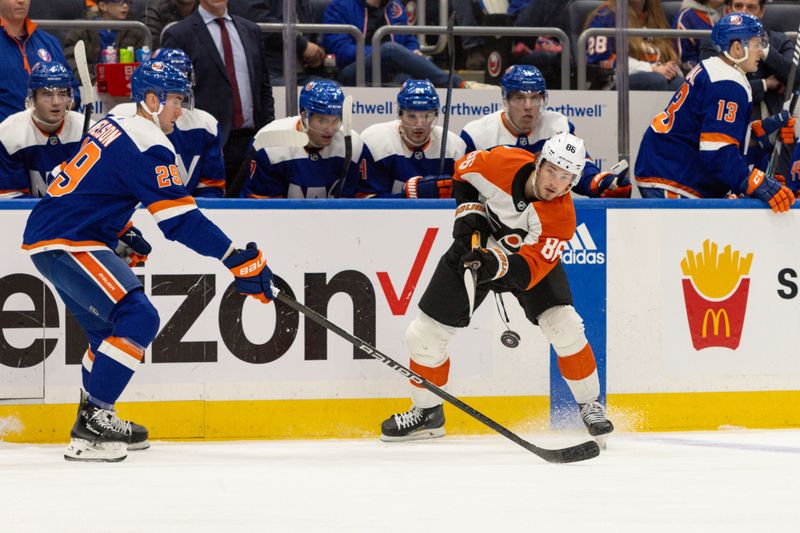 Nov 25, 2023; Elmont, New York, USA; Philadelphia Flyers left wing Joel Farabee (86) makes a pass against the New York Islanders during the first period at UBS Arena. Mandatory Credit: Thomas Salus-USA TODAY Sports