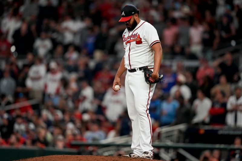 Oct 12, 2022; Atlanta, Georgia, USA; Atlanta Braves relief pitcher Kenley Jansen (74) prepares to throw against the Philadelphia Phillies in the ninth inning during game two of the NLDS for the 2022 MLB Playoffs at Truist Park. Mandatory Credit: Dale Zanine-USA TODAY Sports