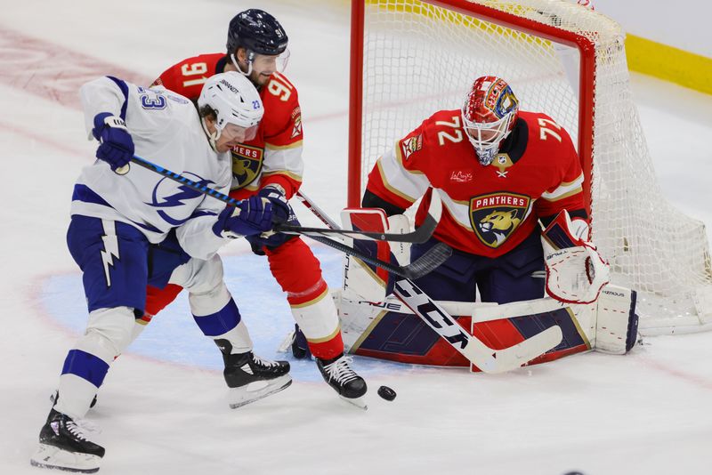 Apr 21, 2024; Sunrise, Florida, USA; Florida Panthers goaltender Sergei Bobrovsky (72) defends his net as Tampa Bay Lightning center Michael Eyssimont (23) and Florida Panthers defenseman Oliver Ekman-Larsson (91) battle for the puck during the third period in game one of the first round of the 2024 Stanley Cup Playoffs at Amerant Bank Arena. Mandatory Credit: Sam Navarro-USA TODAY Sports