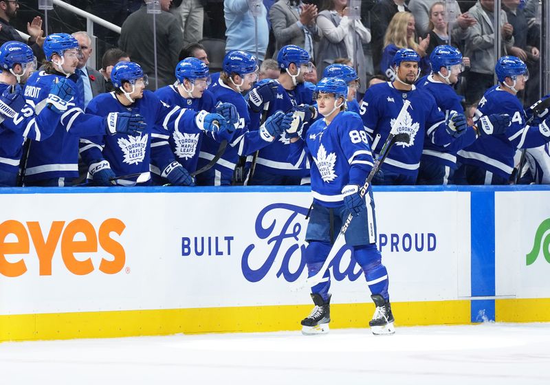 Nov 5, 2024; Toronto, Ontario, CAN; Toronto Maple Leafs right wing William Nylander (88) celebrates at the bench after scoring goal against the Boston Bruins during the second period at Scotiabank Arena. Mandatory Credit: Nick Turchiaro-Imagn Imagess