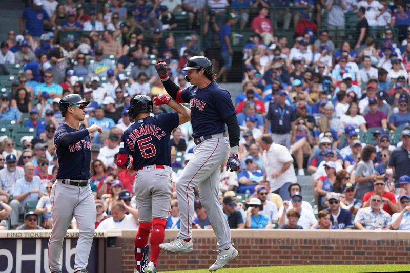 Jul 16, 2023; Chicago, Illinois, USA; Boston Red Sox first baseman Triston Casas (36) is greeted by second baseman Enrique Hernandez (5) after hitting a two run homer against the Chicago Cubs during the eighth inning at Wrigley Field. Mandatory Credit: David Banks-USA TODAY Sports