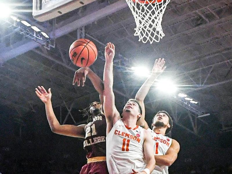 Jan 13, 2024; Clemson, South Carolina, USA; Clemson Tigers guard Joseph Girard III and Boston College Eagles forward Devin McGlockton (21) reach for a ball during the second half at Littlejohn Coliseum. Mandatory Credit: Ken Ruinard-USA TODAY Sports